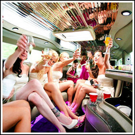School Ball Students celebrating the Ball inside the stretch limousine on the way to the ball.